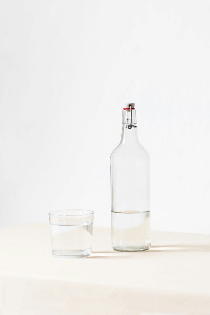 Bottle of water on the table as a visual clue reminding you to drink water during the day