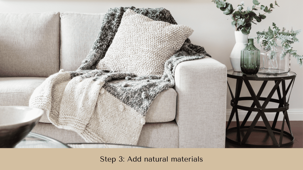Photo of a couch with the woolen blanket. Step 3 to make your home more cozy on a budget.