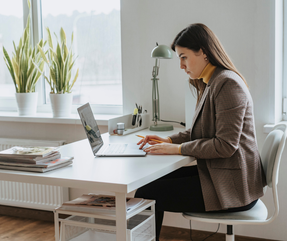 Woman sitting and working at the desk