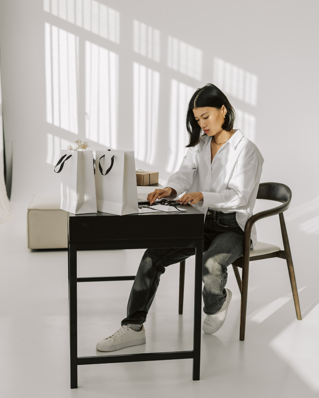 Woman sitting at the desk contenplating about business failures and what she learned from them