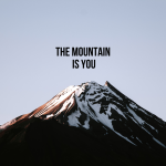 Photo of the mountain with the title of the book The Mountain Is You