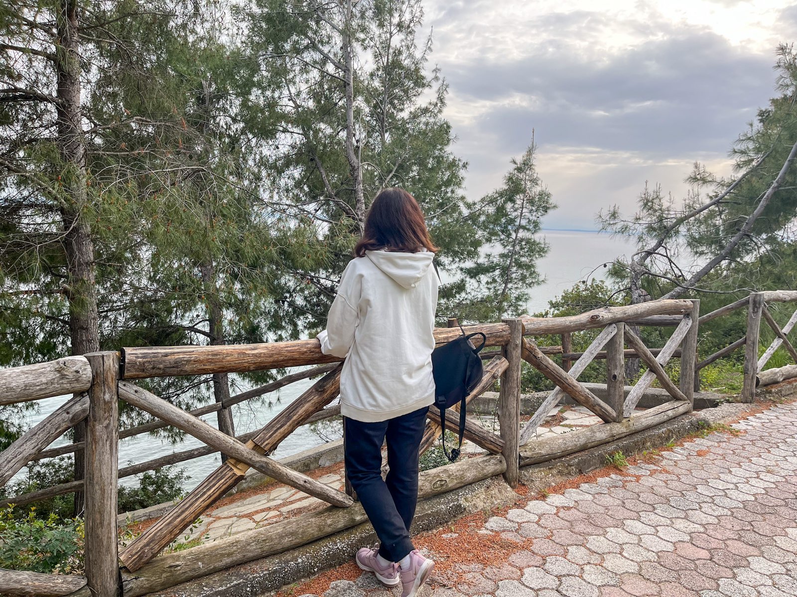 Photo of me standing in front of the sea and woods