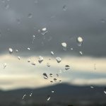 Photo of the rain drops on the window. Slow living habit of watching the rain