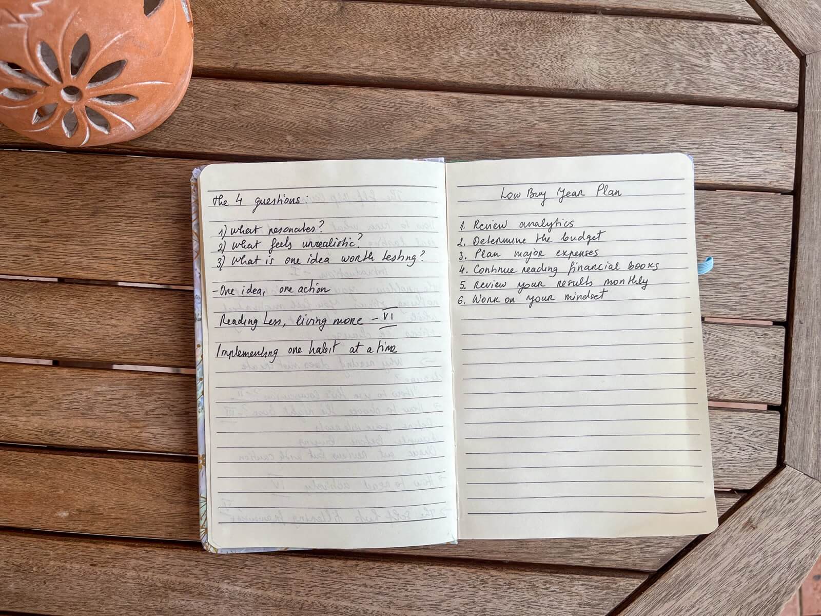 Photo of my journal on the table featuring my Low Buy Year Plan